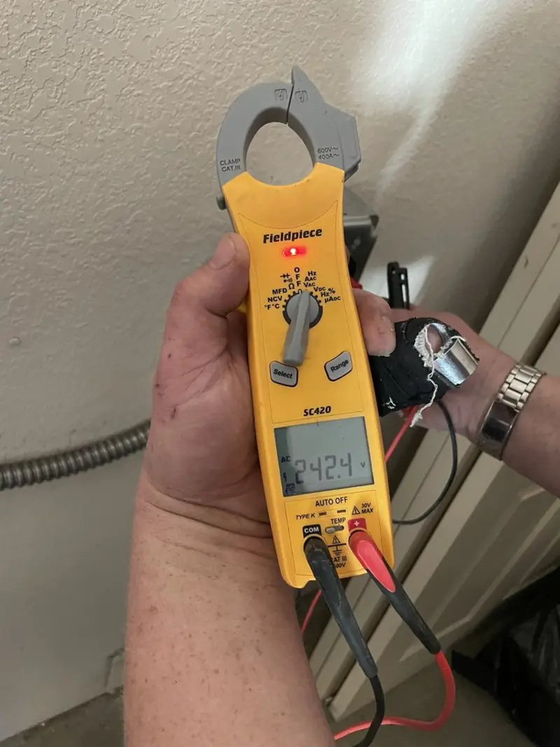 Voltage testing with clamp meter during Outlet Installation in Westwego